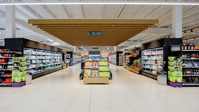 A brightly lit store aisle stocked with products on the shelves