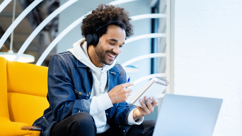 A founder taking notes while working alone in a coworking space