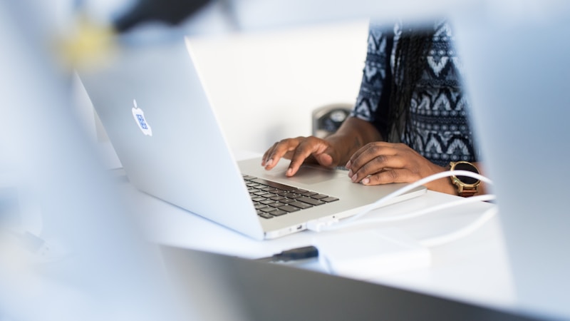 A founder working alone at a laptop on a desk