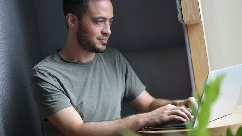 A founder working at a laptop in a quiet coworking space