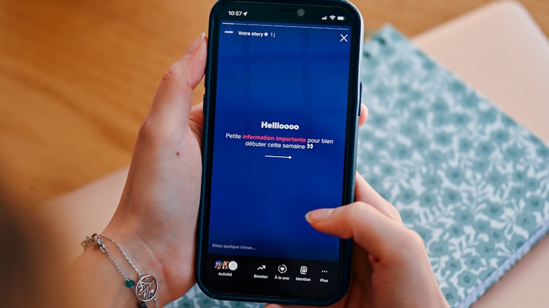 Hands holding a phone scrolling a community feed